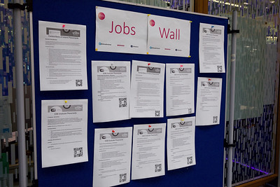 A bulletin board of current WAM opportunities and a QR code to their job descriptions. 